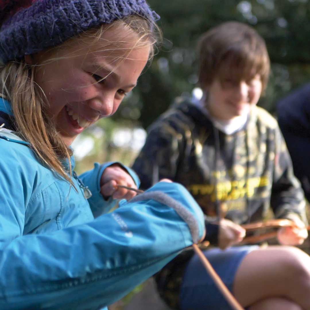 Young person whittling