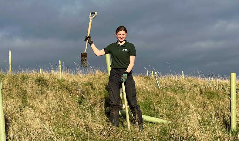 Apprentice planting trees Yorkshire Dales
